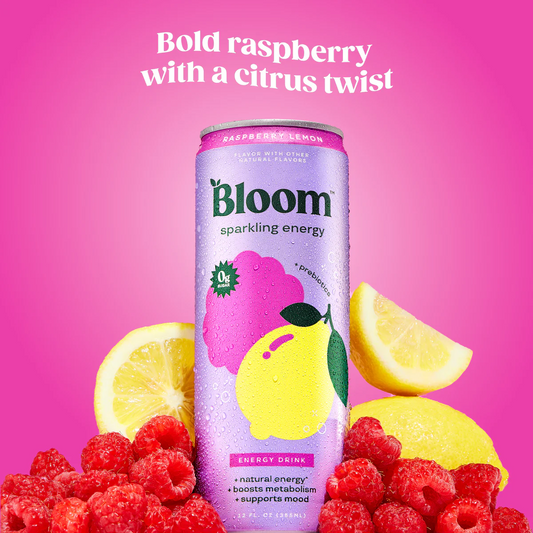 Bloom sparkling energy drink can with raspberries and lemons on a pink background
